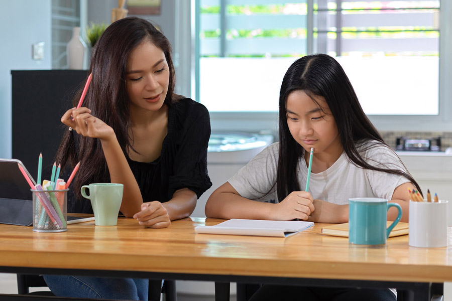 student and tutor together at a desk in Ontario